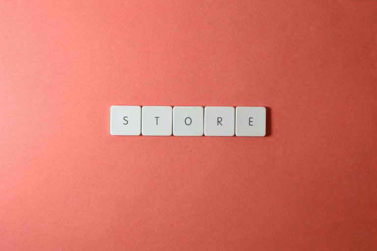 Minimalist conceptual image with 'STORE' spelled out on a red background, perfect for ecommerce themes.